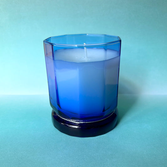Love spell candle in blue vessel